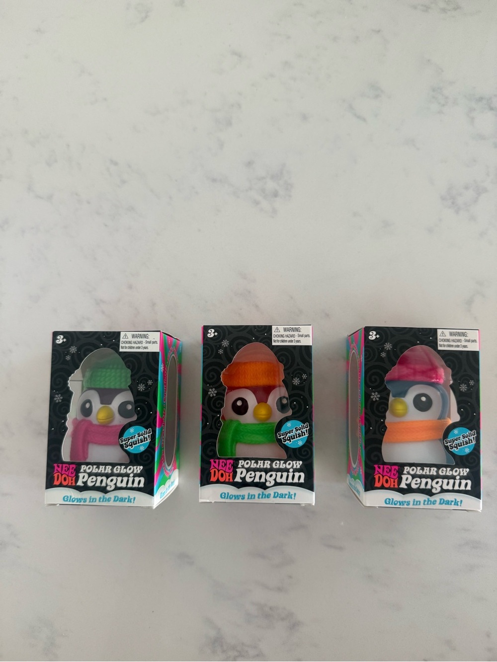NeeDoh Polar Glow Penguin - Set of 3 (Green, Orange, Pink hat)